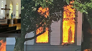 statue of the Blessed Virgin Mary silhouetted against the flames moments before the 125-year-old Church of the Visitation collapsed as flames raced through the historic structure on Monday July 1 2019