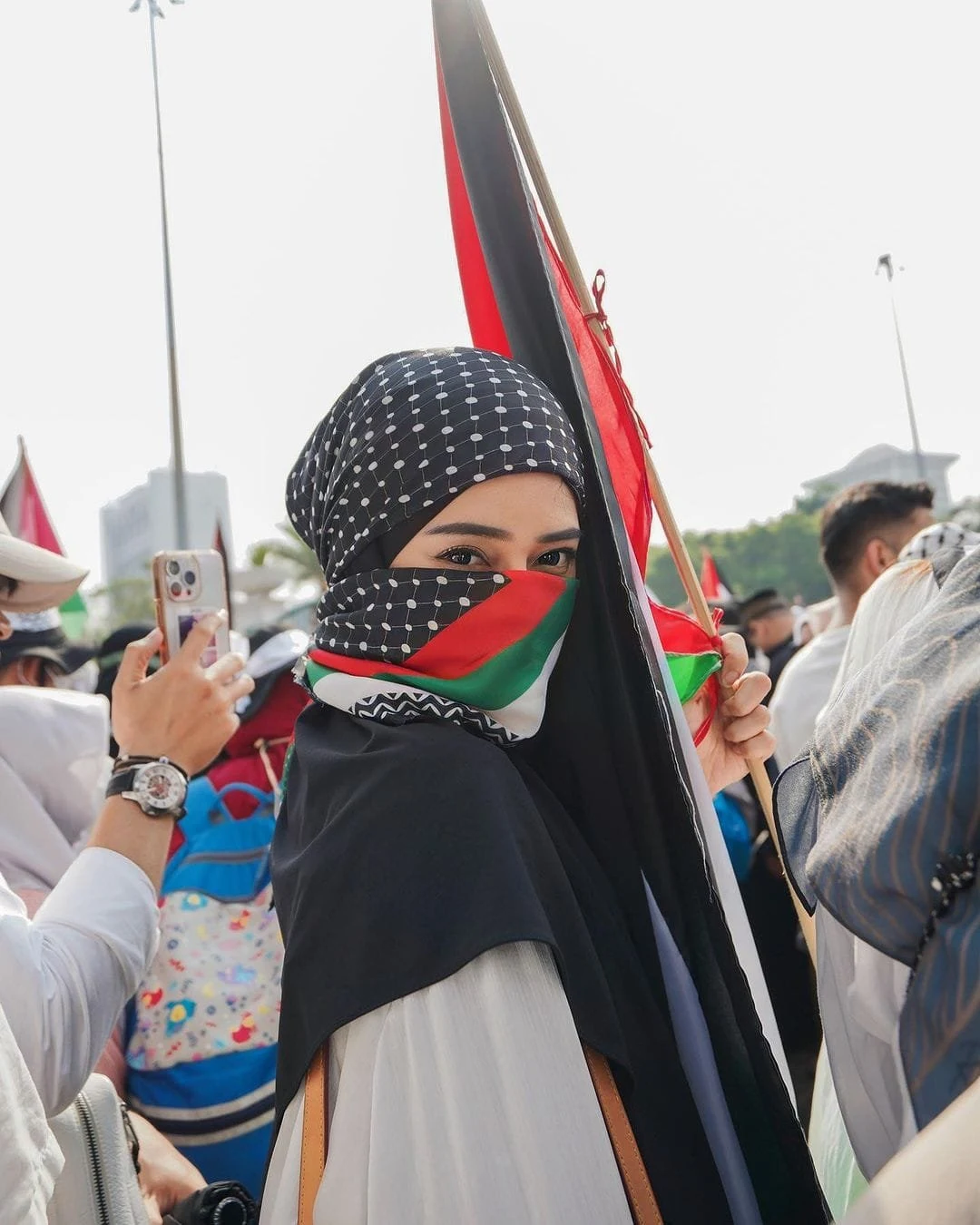 A Girl wearing Keffiyeh Wallpaper