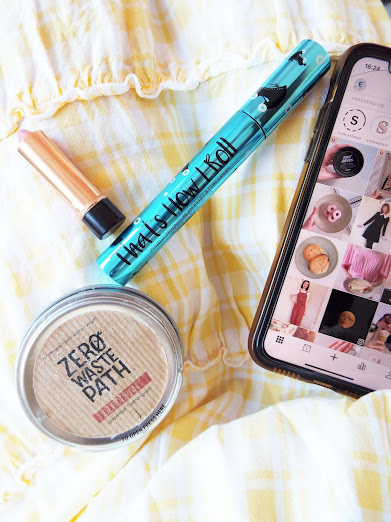 Flatlay of my August beauty favourites and my Instagram grid planned out of the Planoly app, with my yellow gingham dress filling the background.