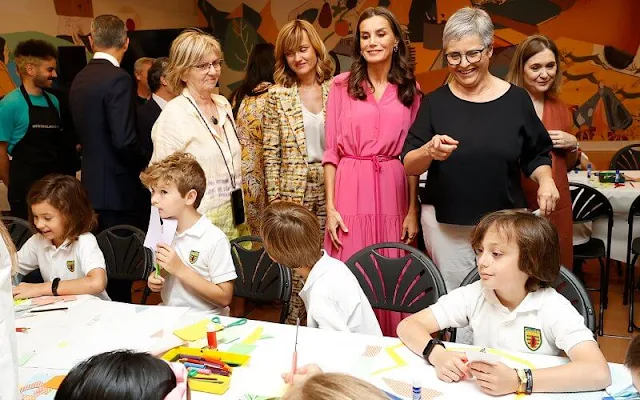 Queen Letizia wore a fuchsia silk georgette maxi dress by Hugo Boss, and fuchsia espadrilles by Castaner