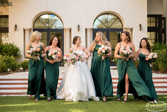 bride with bridesmaids in emerald green