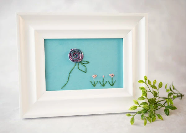 floral paper embroidery design in frame