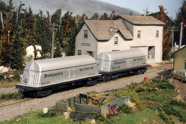 Two Borden's butterdish milk tank cars are awaiting lifting on the 