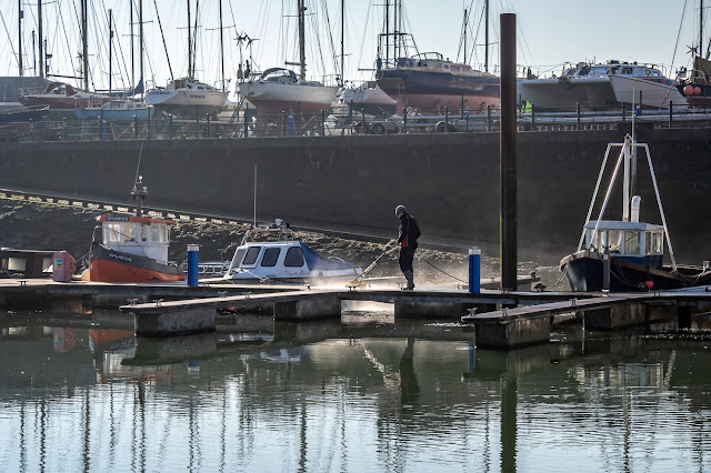 Photo of pressure washing the pontoons at Maryport Marina