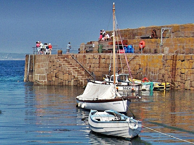 Harbour wall and boats at Mousehole, Cornwall