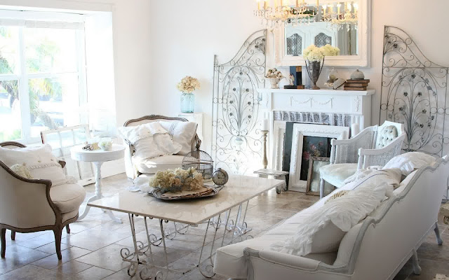 attractive shabby chic living room with vintage granite coffee table and white french sofa