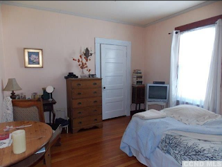 bedroom of red house for sale at 6658 Chester Ave Stottville NY