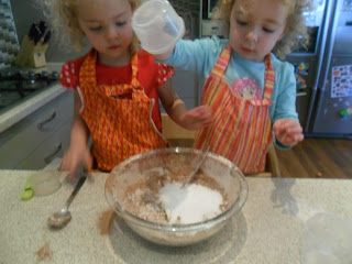 Adding sugar to the mix for brownie recipe.