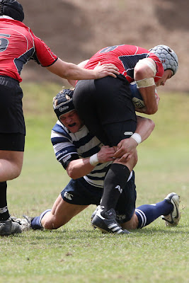 Team Captain and 8-man Steve St. Pierre wraps up his man for the tackle