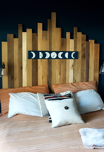Reclaimed Wood Headboard and Moon Sign for a Rustic Boho Bedroom