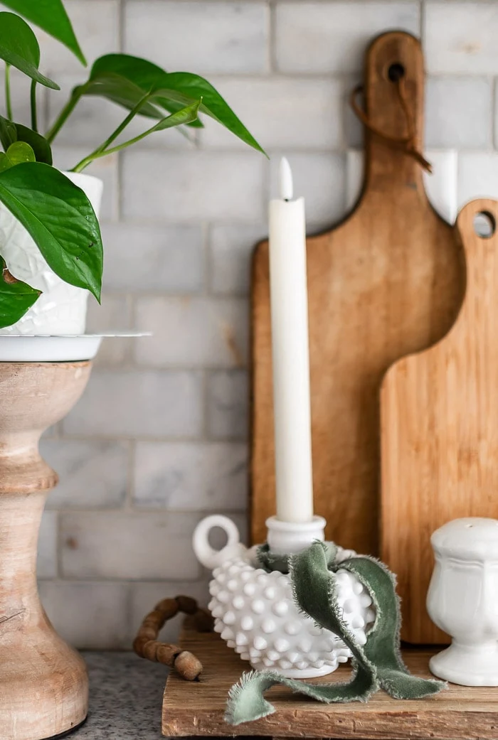 cutting boards, candles, greenery