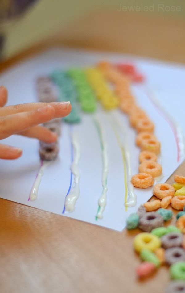 I gave Rosie and Jewel a large bowl of Fruit Loops, and they had lots of fun sorting the colors and placing them onto the rainbow lines