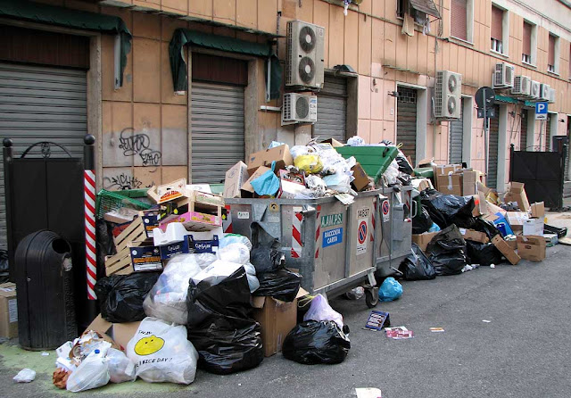 Trash around dumpsters, Livorno