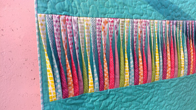 Texture quilt with 3-D twisted strips