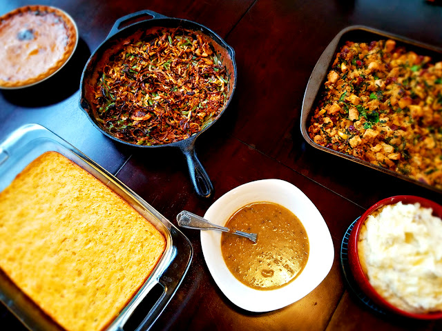 Cranberry, apple, and spinach stuffing; triple corn spoonbread; mashed potatoes; gravy; pumpkin pie; from-scratch green bean casserole