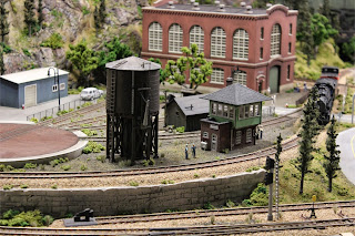 Atlas Signal Tower and Water Tower kits on the edge of the rail maintenance yard