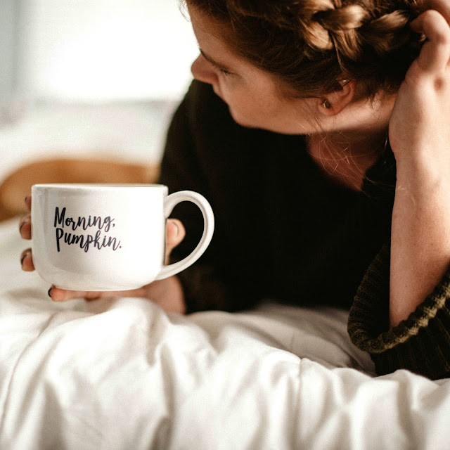 Woman holding a cup of coffee