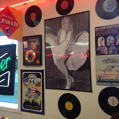 Marilyn Monroe Frame Black and White Photo and Old Records Hanging from the Wall in Charlie Parker's Diner