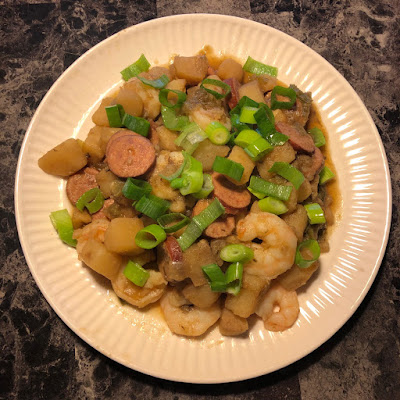 Cajun smothered potatoes with andouille sausage and shrimp