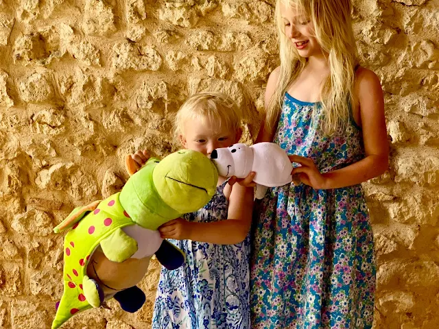 2 girls playing with the FlipaZoo World plushes sent for review