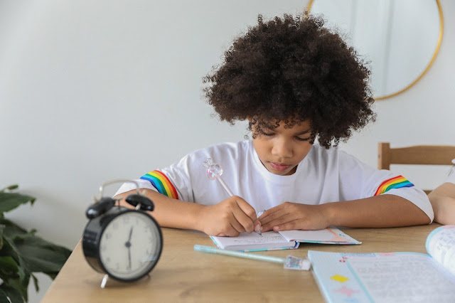 student learning a language with a clock on time