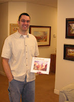 Architect and artist Dan Cross holding Roland Lee's Mukuntuweap book