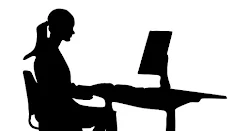 Silhouette of a secretary behind a desktop