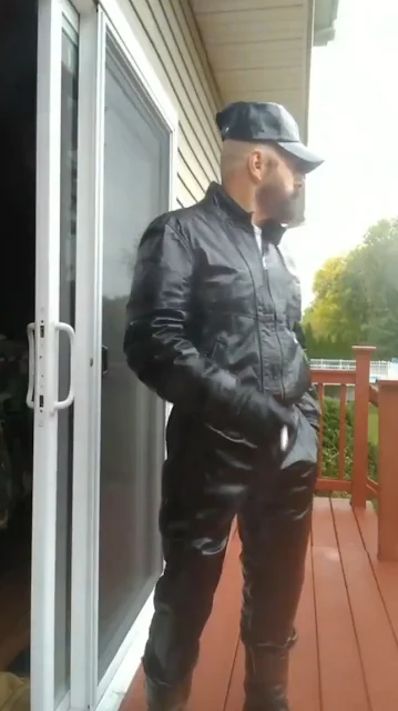 Leather Tracksuit And Hat Wearing Daddy Pimp Smoking A Cigarette