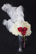 . three red roses, the purple callas and these gorgeous white ostrich .