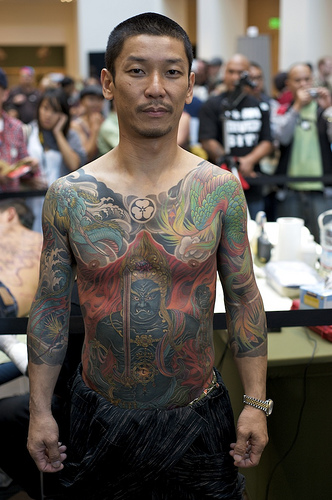 Looks japanese man with full body tattoos is a beautiful work of art