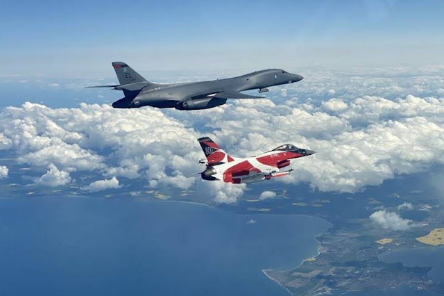 USAF B-1B Lancer trains with colourful Danish F-16 under Bomber Task Force Europe operation
