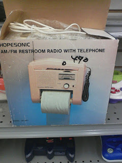 AM/FM restroom radio with telephone. Has toilet paper holder.