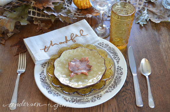 Thanksgiving place setting with a mix and match of dinnerware and glasses. | anderson + grant