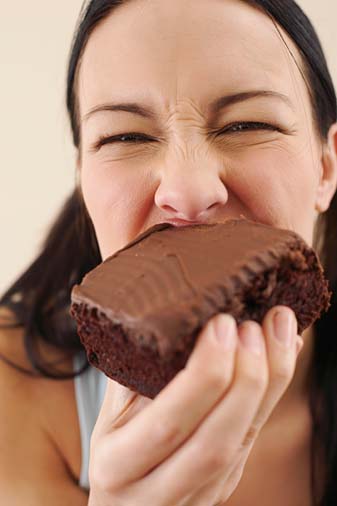 fat person eating burger. might be making you fat!