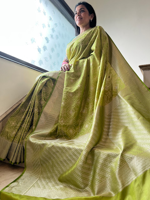 Olive green mushroo silk tanchoi with ikat pattern in the body