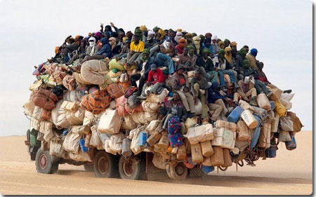 African Truck Covered in People