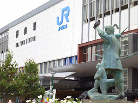 Momotaro peach boy statue of famous Japanese folklore. Okayama station. Tokyo Consult. TokyoConsult.