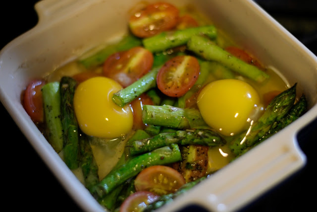 The room tepmerature eggs being added to the baking dish.