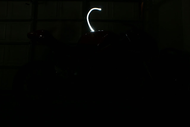 Flashlight behind the bike.