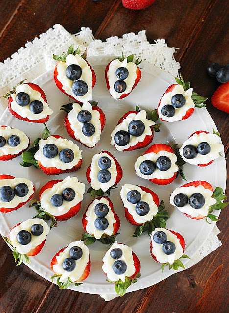 Top View of a Platter of Red White & Blue Strawberry Cheesecake Bites Image