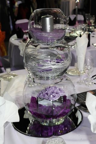 three tiered fish bowl decoration for wedding table design with violet roses, beads and other ornaments