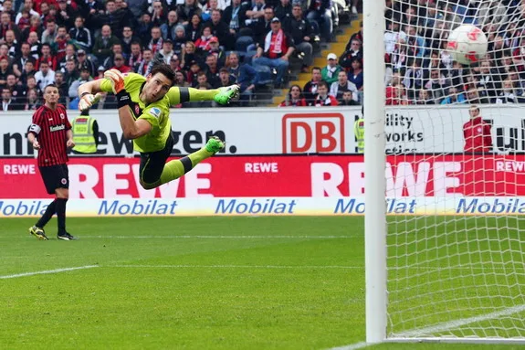 Düsseldorf goalkeeper Fabian Giefer is unable to save a goal from Frankfurt's Alexander Meier