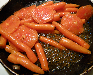 Skillet with Bubbling Glaze, Carrots, and Orange Slices