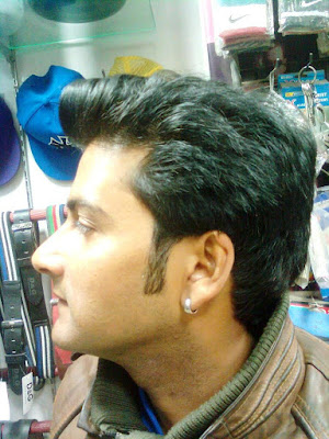 The Indian Nose For Business. A Business Owner in Suburban Delhi poses and shows off his earings too. Actor Material?