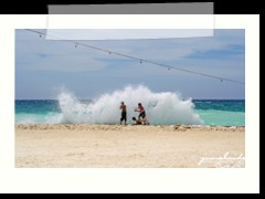 children playing with the waves