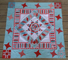 red and aqua string star round robin quilt