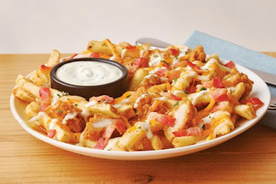 A plate of Applebee's Chicken & Bacon Loaded Fries.