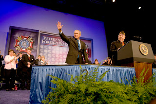 President George W. Bush waves to the crowd as he is introduced by Veterans of Foreign Wars National Commander Gary Kurpius Wednesday, Aug. 22, 2007, to the Veterans of Foreign Wars National Convention in Kansas City, Mo. White House photo by Chris Greenberg