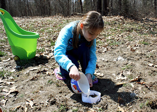 Tessa carefully mixed and then poured plaster of Paris onto a deer print to make a casting.