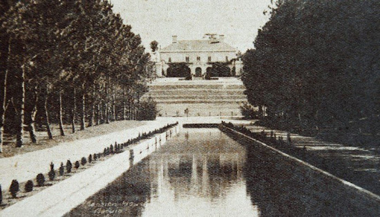 Photo of Mansion House taken at the reflecting pool of Wright Park